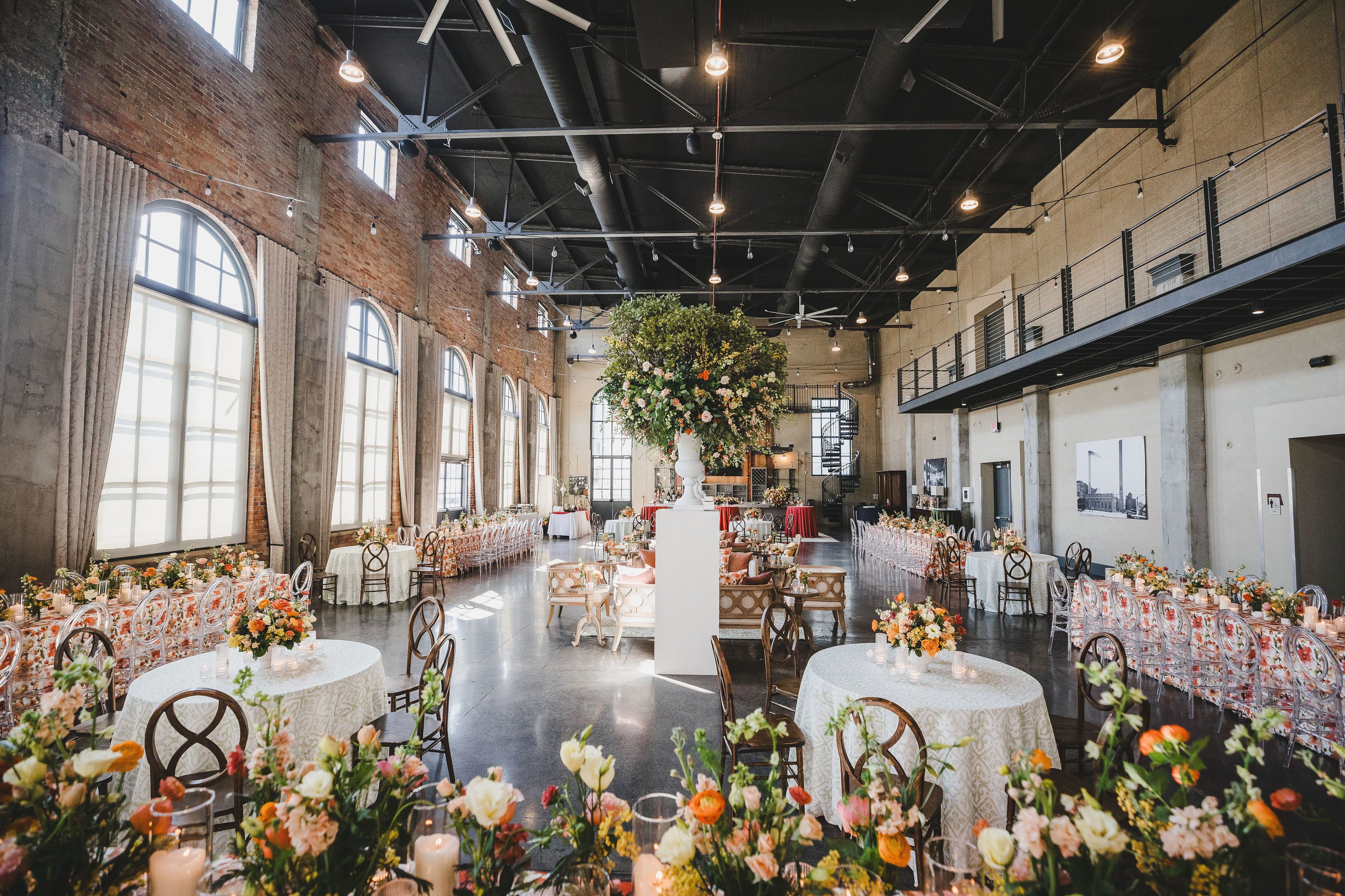 orange summer wedding reception flowers and decor