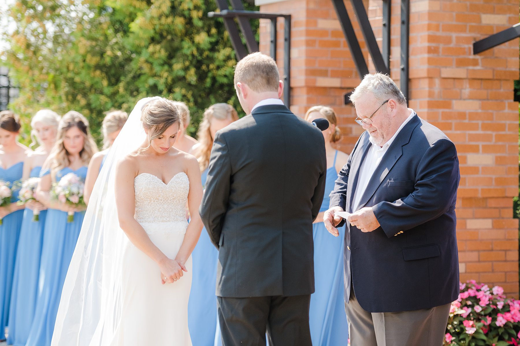 couple praying during wedding ceremony