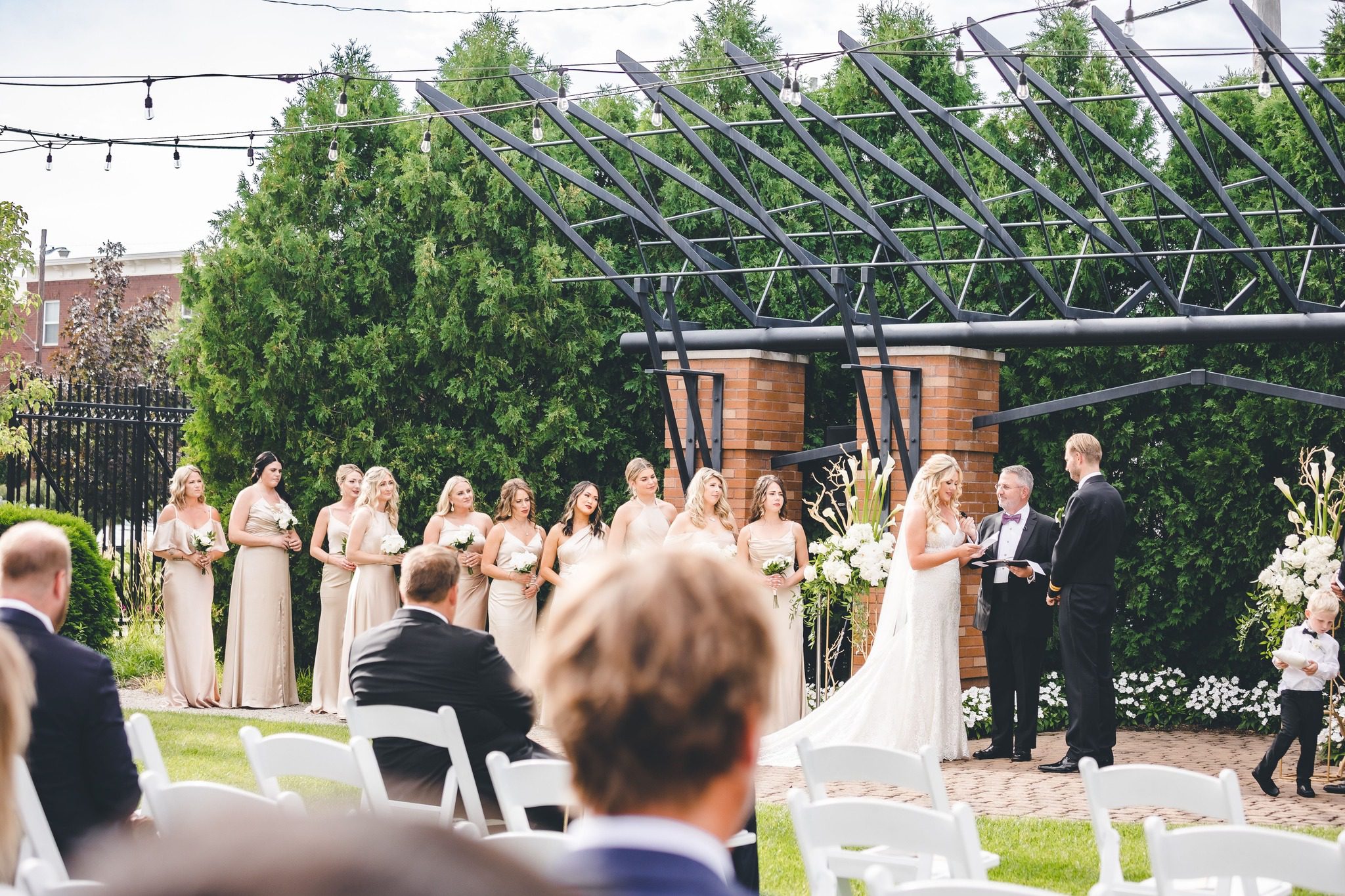 outdoor wedding ceremony under modern pavilion