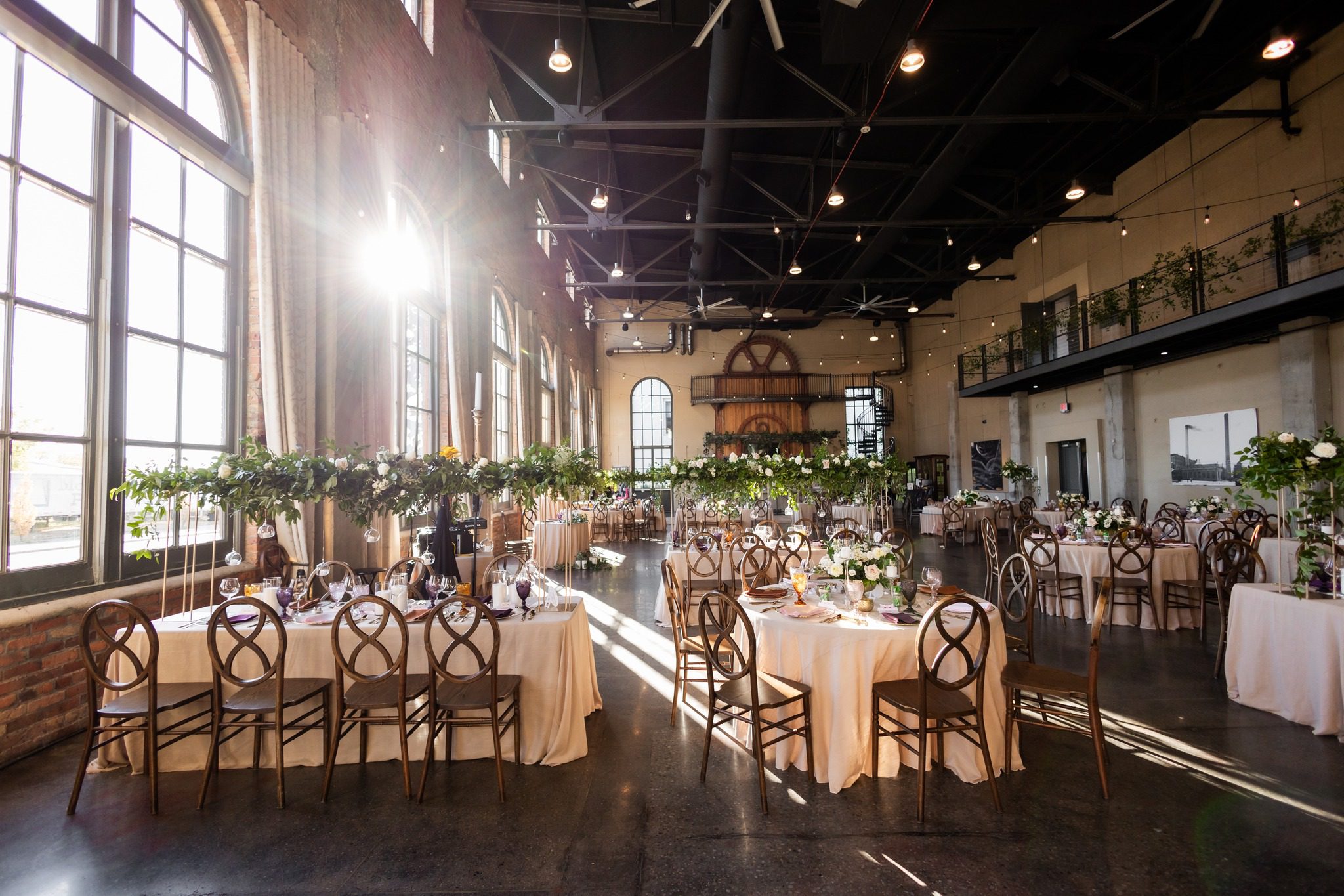 wedding reception venue with large windows and exposed brick