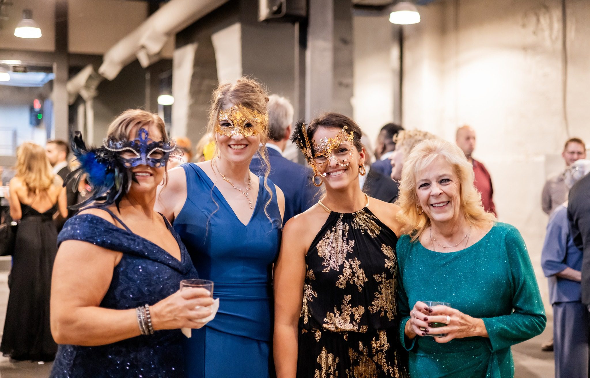 party guests with mardi gras masks