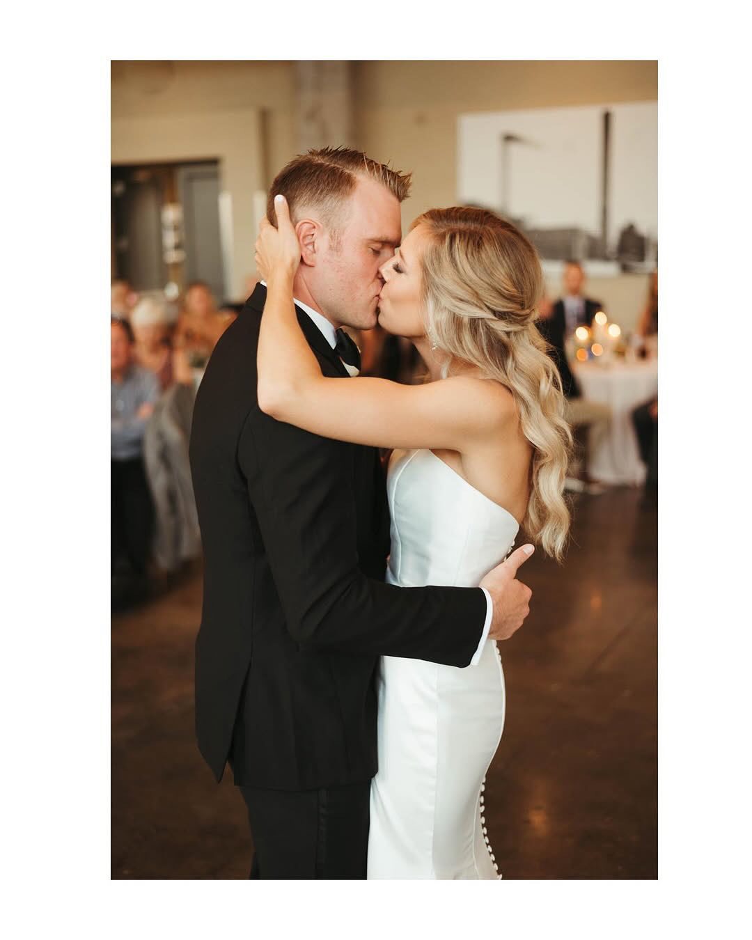 bride and groom kissing on dance floor