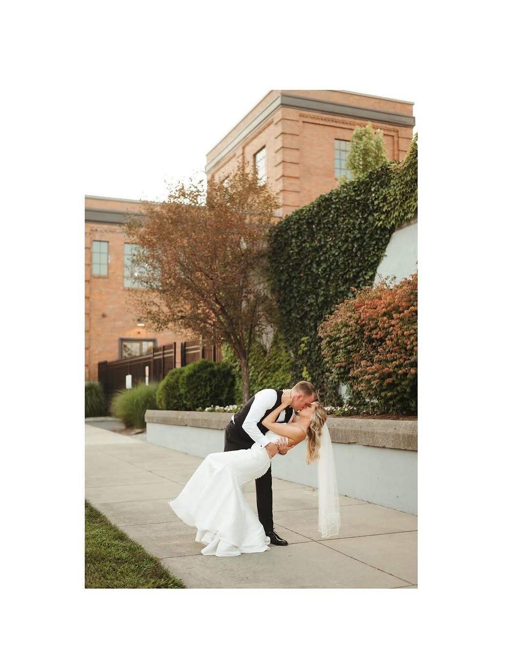 groom dipping and kissing bride