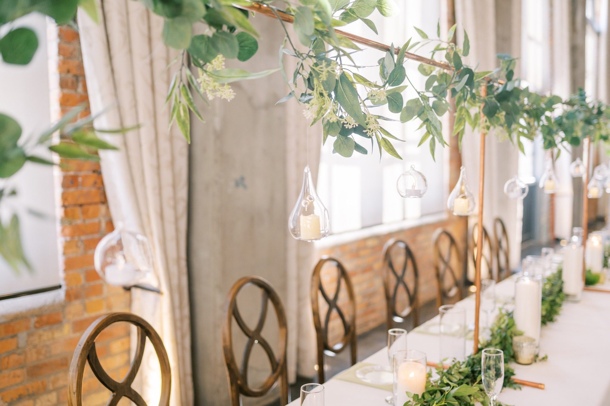 greenery with hanging candles