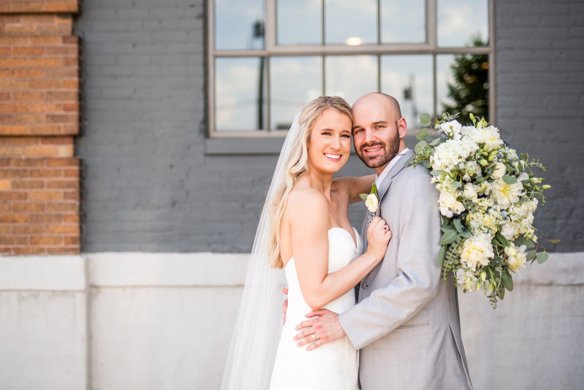 bride and groom embracing